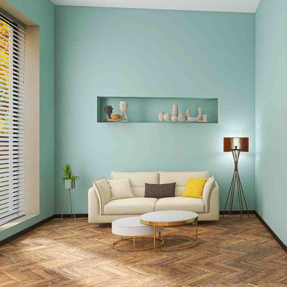 Living room with aqua walls, a cream sofa, herringbone wood floor, and a recessed display niche